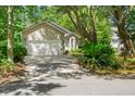 Beautiful home with a long driveway, lush greenery, and mature trees in the yard at 1227 Ocean View Rd, Charleston, SC 29412