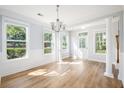 Inviting room with hardwood floors and large windows that provide ample natural lighting at 125 Gaslight Blvd, Summerville, SC 29483