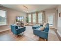 Bright living room featuring comfortable seating, large windows, and stylish decor at 1589 Seabago Dr, Charleston, SC 29414