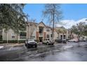 Exterior complex with parking spots on wet pavement at 1600 Long Grove Dr # 1512, Mount Pleasant, SC 29464