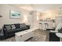 Cozy living room, connecting to a full kitchen, featuring an open concept design at 1600 Long Grove Dr # 1512, Mount Pleasant, SC 29464