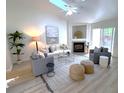 Inviting living room with a fireplace, modern decor, and plenty of natural light at 1705 Bassett Ct, Charleston, SC 29412
