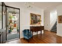 Elegant foyer featuring hardwood floors, wainscoting, chandelier, and a view into the front yard at 18 Fernandina St, Mount Pleasant, SC 29464