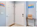 Functional foyer features a white closet door, gray front door, and neutral-toned walls at 210 Allen Richard Ct # A&B, Moncks Corner, SC 29461