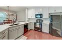 Bright kitchen with stainless steel appliances, light countertops, white cabinets, and wooden floors at 2244 Ashley Crossing Dr # 532, Charleston, SC 29414
