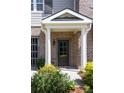 Inviting brick front porch with columns and landscaping, enhancing the curb appeal of this charming home at 225 Slipper Shell Ct, Mount Pleasant, SC 29464