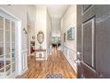 Elegant foyer with high ceilings, hardwood floors, and decorative wall trim at 227 Spectrum Rd, Summerville, SC 29486