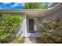 Inviting covered front porch with charming landscaping providing curb appeal at 2418 Castlereagh Rd, Charleston, SC 29414