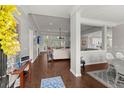 Bright and airy living room with hardwood floors, open floor plan, and view of the kitchen at 2772 Latrobe Ct, Mount Pleasant, SC 29466