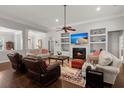 Inviting living room features a fireplace, built-in shelves, hardwood floors, and a comfortable seating area at 2772 Latrobe Ct, Mount Pleasant, SC 29466