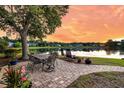 Backyard patio overlooking a serene lake, complete with outdoor seating at 3310 Hartwell St, Johns Island, SC 29455