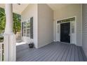 Exterior view highlighting the home's front porch and door, siding, and a side window at 3872 James Bay Road Rd, Johns Island, SC 29455