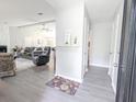 Inviting open-concept living space features gray flooring, neutral paint and an abundance of natural light at 5 Drummond Ct, Charleston, SC 29414