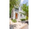 Beautiful two-story home with a front porch, mature trees, and street access at 50 South St, Charleston, SC 29403