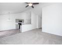 Bright living room featuring neutral carpet, an open floor plan, and white walls at 5042 Thornton Dr, Summerville, SC 29485