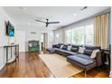 Sun-lit living room featuring hardwood floors, neutral walls, and a comfortable sectional sofa at 5043 Victoria Ave, North Charleston, SC 29405