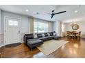 Comfortable living area featuring hardwood floors, neutral walls, and an open floor plan at 5043 Victoria Ave, North Charleston, SC 29405
