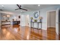 Spacious open-concept living area with hardwood floors, neutral walls, and modern light fixtures at 5043 Victoria Ave, North Charleston, SC 29405