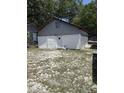 Large detached garage with white doors offering ample storage space at 505 Blacks St, Walterboro, SC 29488