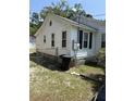 Side exterior view showing fenced yard and access to the home's foundation at 505 Blacks St, Walterboro, SC 29488