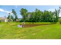 Community pond with lush landscaping, offering a serene outdoor space for residents at 5138 Preserve Blvd, Ladson, SC 29456