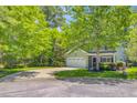 Charming two-story home featuring a manicured lawn, attached garage, and welcoming front porch at 5433 Falling Tide, North Charleston, SC 29420