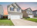 Well-maintained home with a two-car garage, neat landscaping, and vinyl siding at 743 Redbud Ln, Summerville, SC 29486