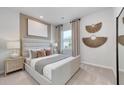 Serene bedroom with a padded headboard, neutral decor, and stylish wall art create a relaxing atmosphere at 760 Meadowbrook Ln, Summerville, SC 29486