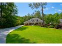 Beautiful single-story home featuring a well-manicured lawn and an extensive driveway at 101 Firestone Ct, Summerville, SC 29483