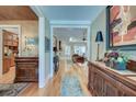 Elegant hallway showcasing hardwood floors and views into the dining and living spaces at 101 Firestone Ct, Summerville, SC 29483