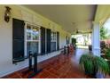 Relaxing outdoor porch with tile flooring, rocking chairs, and open views at 101 Firestone Ct, Summerville, SC 29483