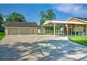 Spacious driveway leads to garage and covered parking, offering ample space for vehicles and storage at 101 Parkside Dr, Goose Creek, SC 29445