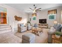 Cozy living room with neutral tones, comfortable seating, and a ceiling fan for relaxed living at 101 Parkside Dr, Goose Creek, SC 29445