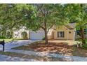 Charming home boasts mature trees, a two-car garage, and a well-kept lawn with pine straw at 105 Moon Shadow Ln, Summerville, SC 29485