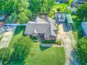 Expansive property with a brick home, detached garage, and lush greenery in a tranquil neighborhood at 1111 Ole South Ct, Moncks Corner, SC 29461