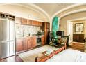 Efficient kitchenette featuring stainless steel appliances and sleek cabinetry at 12 Bee St # C, Charleston, SC 29403