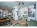 Cozy living room area featuring a chair, shelving unit, and staircase at 1242 Allusion Ln # 206, Mount Pleasant, SC 29466