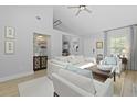 Inviting living room with vaulted ceiling and sight lines to a display cabinet at 1308 Cadet Ct, Mount Pleasant, SC 29466