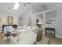 Bright living room with vaulted ceiling and sight lines to the kitchen at 1308 Cadet Ct, Mount Pleasant, SC 29466