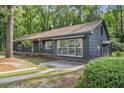 Beautiful home with a private drive and multiple windows for natural light at 205 Woodlawn St, Walterboro, SC 29488