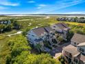 Stunning aerial view of the townhome community with marsh views at 2087 Sterling Marsh Ln, Seabrook Island, SC 29455