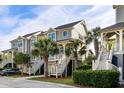 Charming two-story townhome with beautifully landscaped grounds and palm trees at 2087 Sterling Marsh Ln, Seabrook Island, SC 29455
