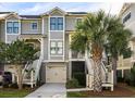 Inviting two-story townhome with well-manicured landscaping and garage at 2087 Sterling Marsh Ln, Seabrook Island, SC 29455