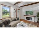 Cozy living room with a modern fireplace, comfortable seating, and natural light offers relaxation at 2963 Alabama Dr, North Charleston, SC 29405