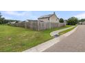 View of a fenced yard showing wooden privacy fence and healthy green grass at 301 Edenton Rd, Goose Creek, SC 29445