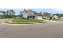 Residential home on a corner lot with a manicured lawn and a two-car garage at 301 Edenton Rd, Goose Creek, SC 29445