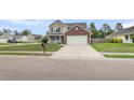 Beautiful home with a two-car garage, manicured lawn and long driveway at 301 Edenton Rd, Goose Creek, SC 29445