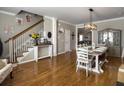 Formal dining room features hardwood floors, wainscoting, and modern lighting at 301 Mondo Ct, Summerville, SC 29486
