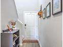 Bright entryway featuring decor and a staircase, complemented by neutral wall paint and light flooring at 307 Fox Gap Rd, Summerville, SC 29486