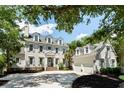 Stately home featuring blue shutters, dormer windows, and a brick walkway to the front door and two-car garage at 3508 Henrietta Hartford Rd, Mount Pleasant, SC 29466